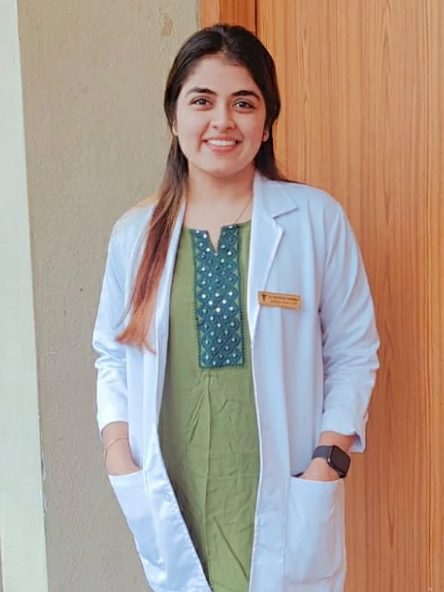 Dr. Shivangi Sharma, dentist at Curve Orthodontics, in a white dental coat